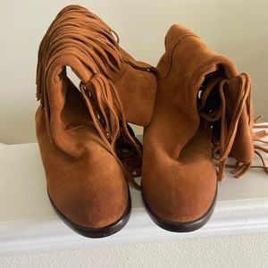Cowhide fringe boots.